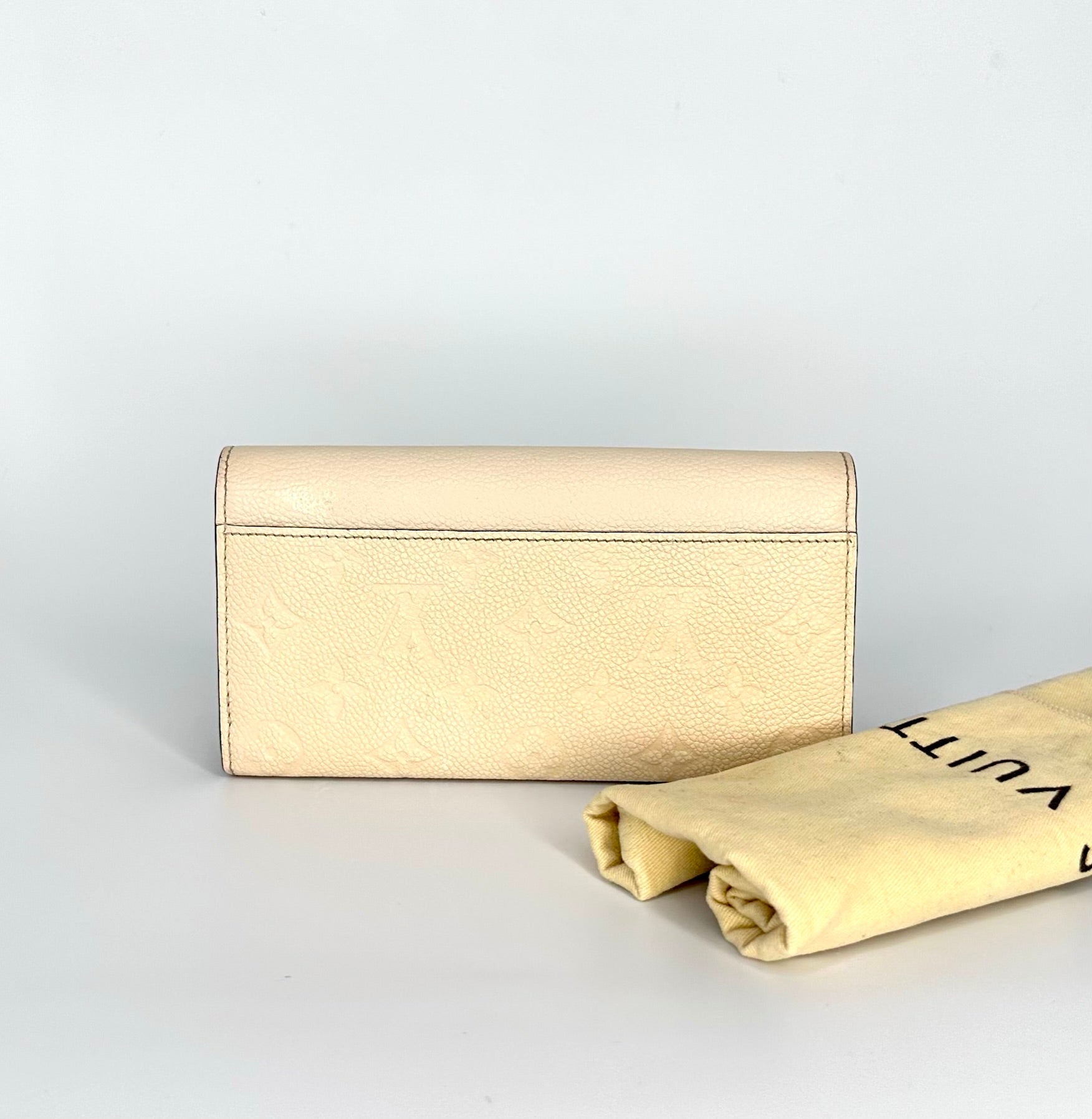 LOUIS VUITTON Cream Monogram Empreinte Leather Sarah Wallet